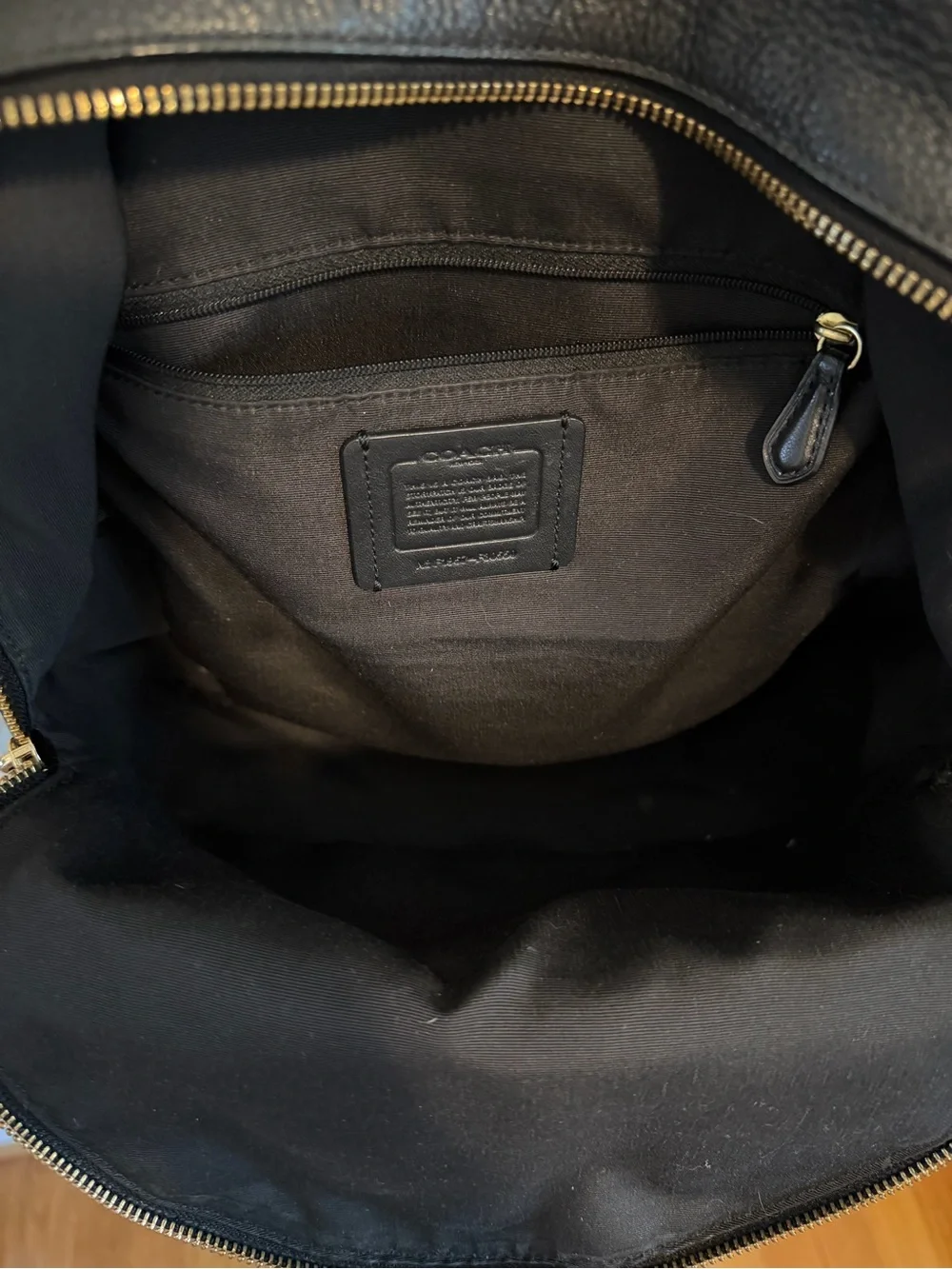Coach compact pebbled